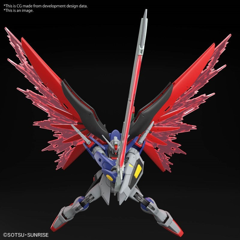 Maquette Gunpla HG 1/144 Destiny Gundam Spec II & Zeus Silhouette avec armement géant, ailes rouges et blanches sur fond blanc.