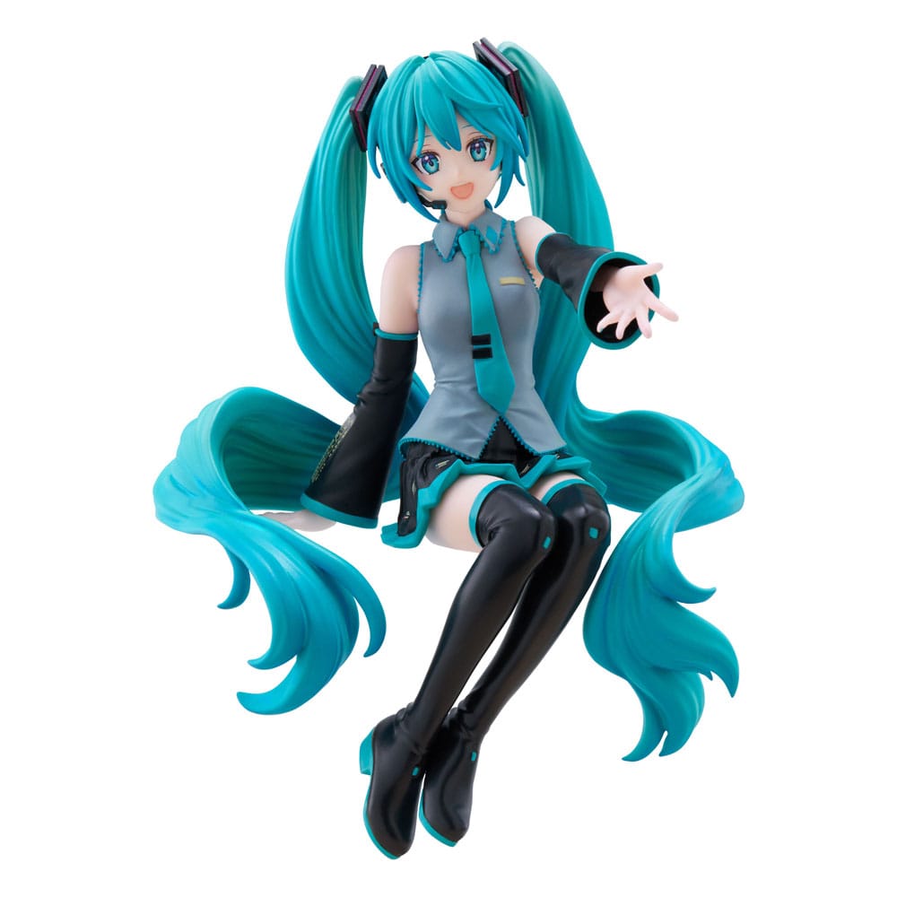 Figurine Hatsune Miku Nardack Ver. de 14 cm, en tenue classique bleu et noir, avec de longues couettes turquoise et une main tendue vers l’avant.