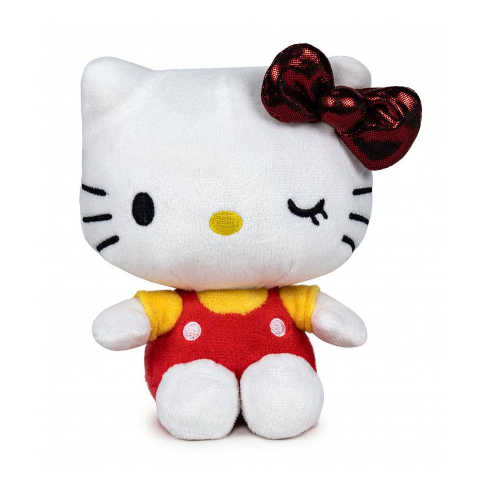 Peluche Hello Kitty 16 cm édition 50e anniversaire, en salopette rouge à pois, t-shirt jaune, nœud rouge brillant et clin d’œil joyeux.