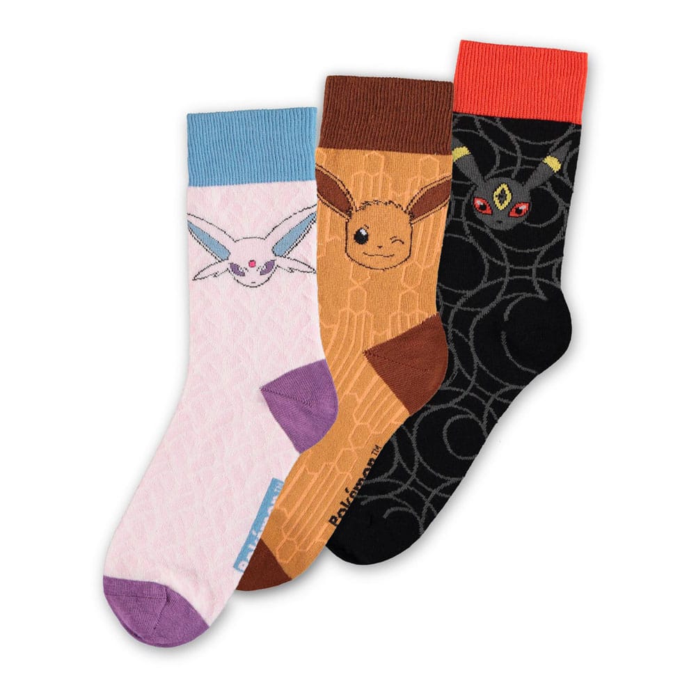 Pack de trois chaussettes Pokémon représentant Évoli, Mentali en rose et Noctali en noir avec embouts colorés assortis.