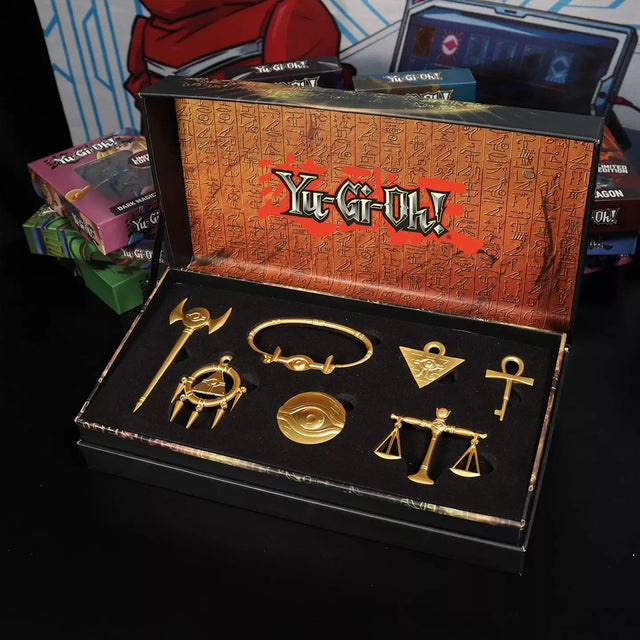 Coffret premium Yu-Gi-Oh! répliques officielles des 7 Objets du Millénium en métal doré