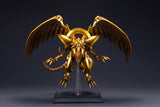 Figurine Yu-Gi-Oh! The Winged Dragon of Ra Egyptian God, dragon doré aux ailes déployées sur socle transparent.