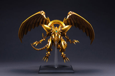 Figurine Yu-Gi-Oh! The Winged Dragon of Ra Egyptian God, dragon doré aux ailes déployées sur socle transparent.