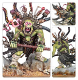 Figurine Warhammer 40,000 Orks Bizarboy, psyker ork avec bâton, câbles et équipement étrange sur socle décoré.